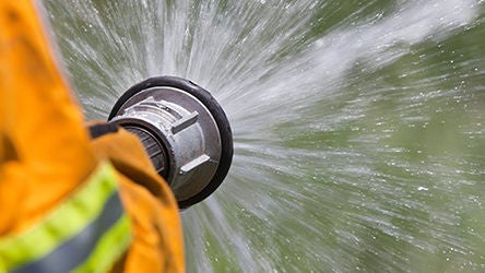 firehose spraying water