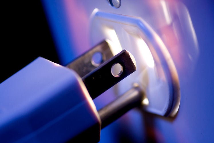 What causes a surge Plug getting inserted into a receptacle