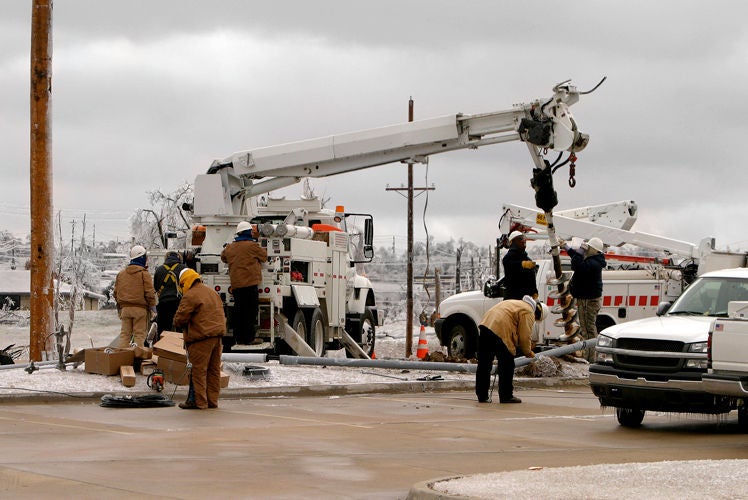 Work being done to repair storm damage in winter Work being done to repair storm damage in winter